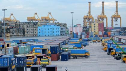 An image of lorries and containers in a port in Bangladesh